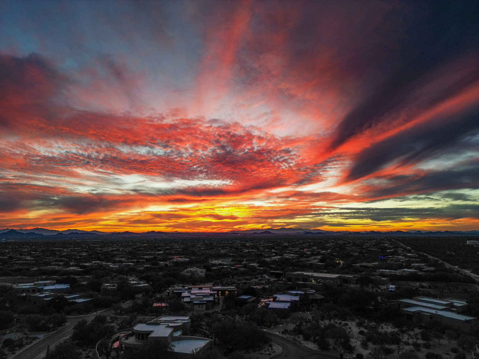 Desert sunset over a hillside town in Scottsdale, Arizona