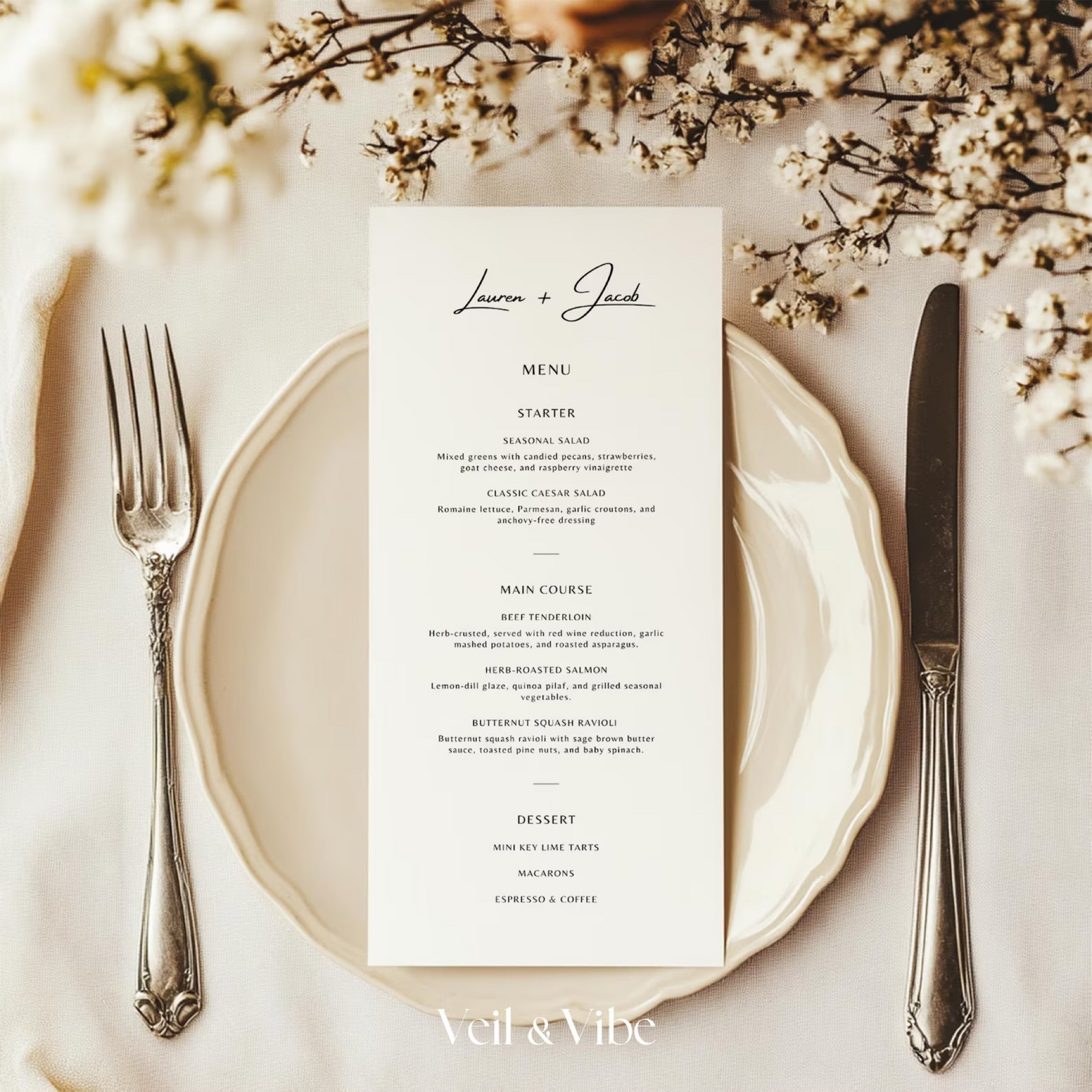 Laptop open to a wedding website design with soft floral accents nearby